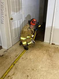 Junior FF King was given an opportunity in this acquired structure to work on  advancing a handline down a hallway to a back bedroom